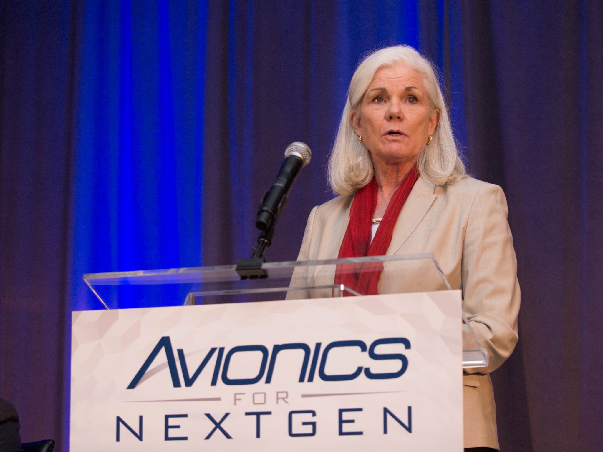 Caption: Mary McMillan, Vice President Aviation Safety and Operational Services, Inmarsat, speaks to upcoming flight tracking requirements during the Avionics for NextGen conference on Sept. 28.