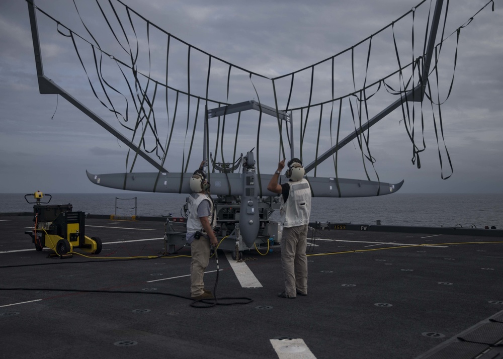 A Textron Aerosonde Unmanned Aerial Surveillance (UAS) vehicle, named Buck G, returns to the Expeditionary Sea Base ship USS Hershel “Woody” Williams (ESB-4) from a 10- hour night surveillance in the Atlantic Ocean on Sept. 26, 2020. (Photo: U.S. Marine Corps by Sgt. Megan Roses/Released)